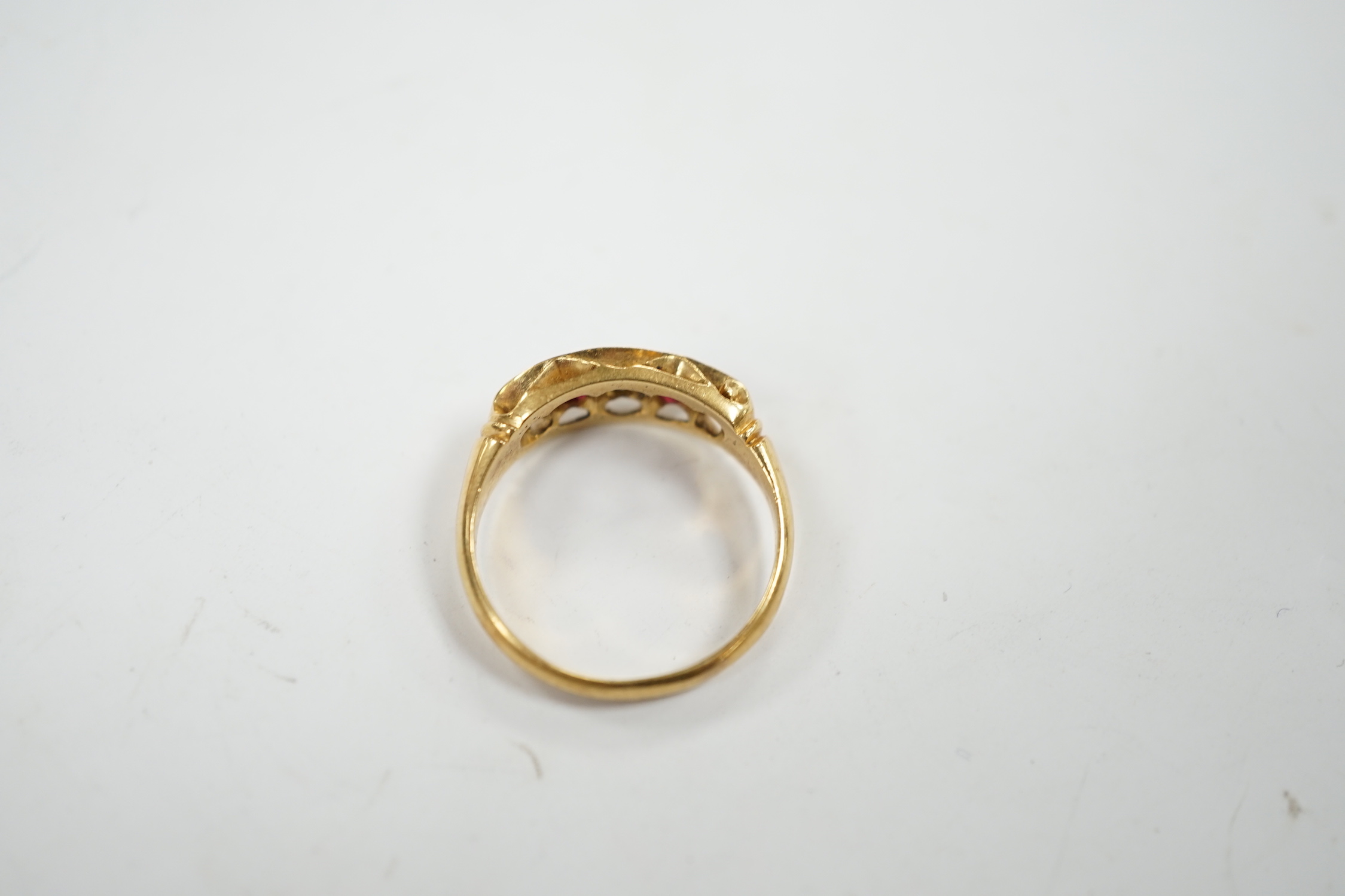 A George V 18ct gold, three stone diamond and two stone ruby set half hoop ring, size N, gross weight 3.8 grams.